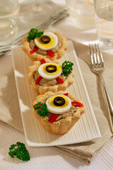Tartlets with cheese and olives.
