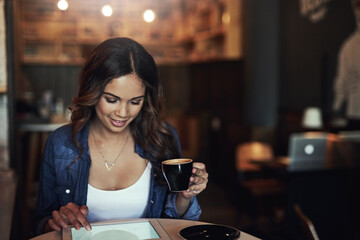 Woman, coffee and browsing with tablet in cafe, digital screen and smiling or online for social media or news. Relax, connection and freelance blogger with tech, restaurant and website search