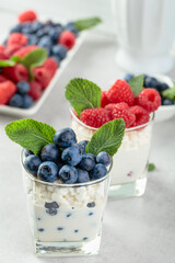 Cottage cheese with cream, raspberries, and blueberries.
