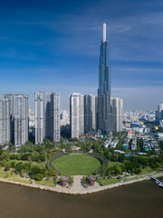 Landmark building and Central park along the Saigon River on beautiful sunny day with blue skies showing impressive architecture and landscaping in Ho Chi Minh City, Vietnam