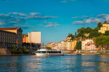 Obraz premium A Tourboat in the Saône River at sunset, Lyon, France