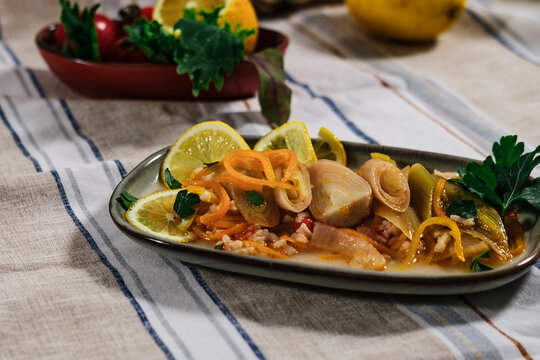 turkish style braised leek dish with rice, olive oil and lemon ingredients, vegetarian mediterranean diet cuisine, zeytinyagli pirasa