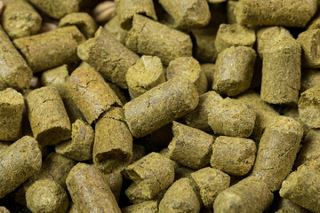 Close up granulated hops. Ingredient for Industrial production of beer.