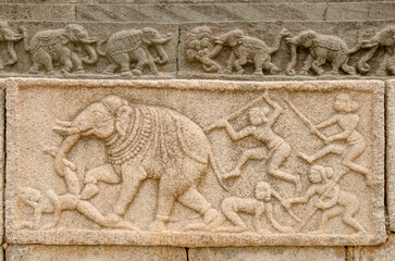Mural sculpture on stone at Royal Enclosure. Base of Mahanavami Dibba or the Dussehra Platform. Hampi, Karnataka, India, Asia. 