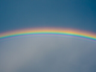 rainbow over blue sky