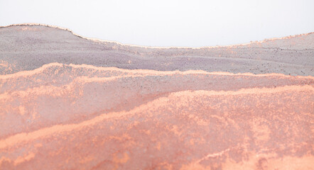 Fototapeta premium A close-up abstract art piece depicting a soft, textured landscape in shades of pink, lavender, and gray