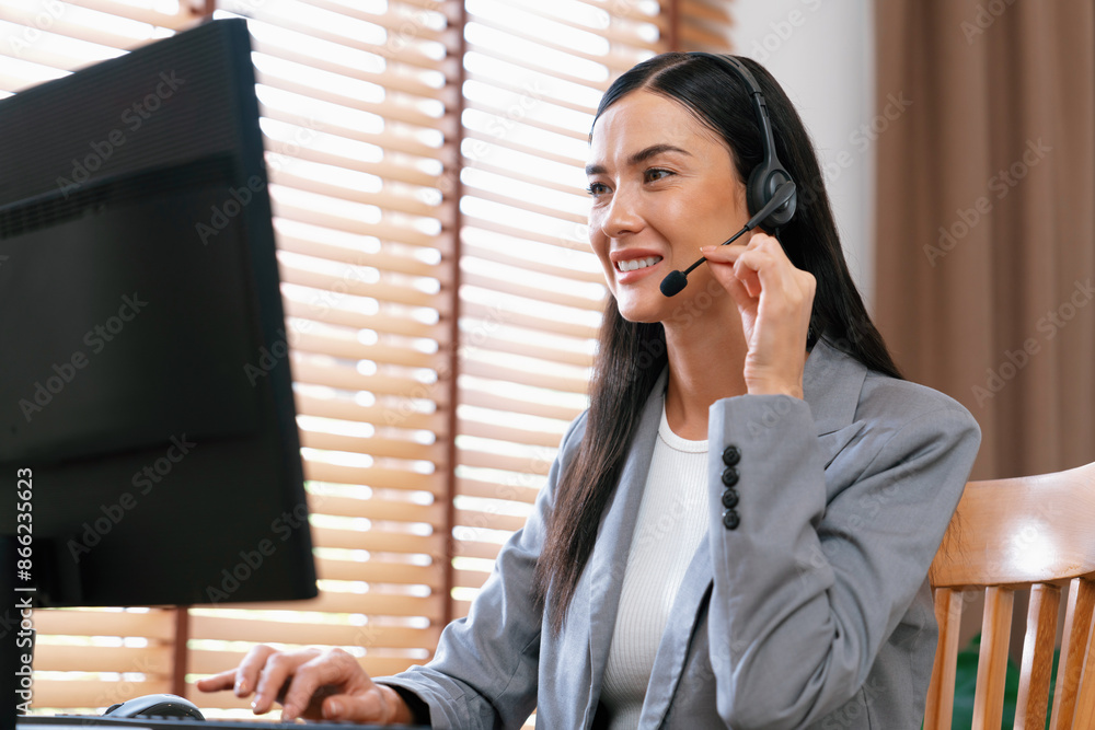 Aufkleber female call center operator or customer service helpdesk staff working on workspace while talking on