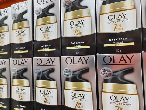 Olay day cream boxes displayed on a supermarket shelf