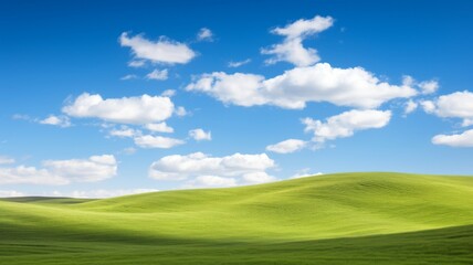 Idyllic Rolling Green Hills Under a Bright Blue Sky with White Clouds