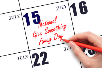 July 15. Hand writing text National Give Something Away Day on calendar date. Save the date.