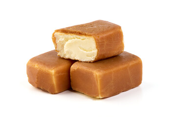 Cheesecake candy bar with caramel glaze, caramel curd cheese, isolated on white background.