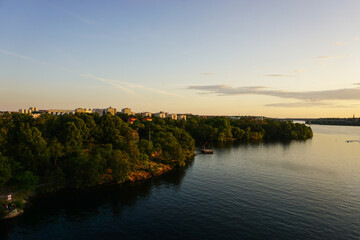 Scenic view of river against sky at sunset