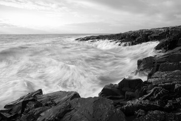 Dramatic Waves Crashing on The Rock