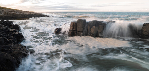 Dramatic Waves Crashing on The Rock