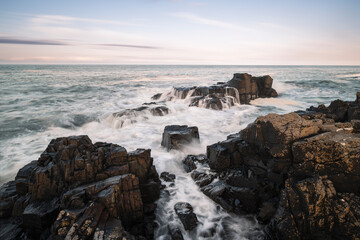 Dramatic Waves Crashing on The Rock