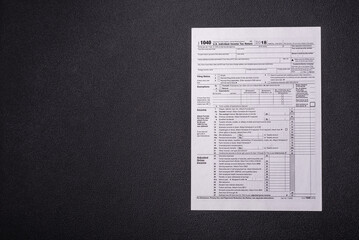 Fototapeta premium Fill out US tax form 1040 for verification and refund
