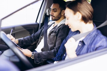 Woman passing driving test at driving school