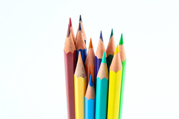 a bunch of colored pencils isolated on white background close up