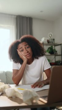 Vertical portrait of exhausted tired young woman student or freelancer with failed ideas while take break at home workplace Tired female with creative block or lack of inspiration indoors	