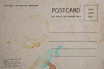 Backside of old postcard with dirty stain
