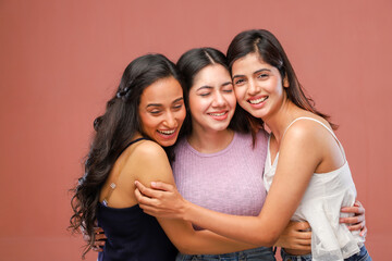 Three Young Innocent Friends Hugging Each Other