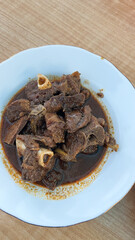 Spicy Goat tengkleng rica meat on a plate