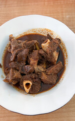 Spicy Goat tengkleng rica meat on a plate