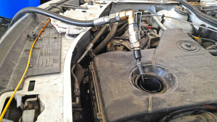 Vidange de moteur de voiture par aspiration