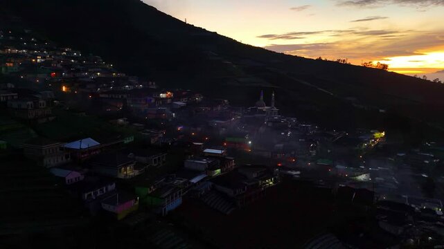 Aerial view of hazy morning dawn in rural landscape of Indonesia. Nepal Van Java village, Mount Sumbing, Indonesia. 4K drone shot.
