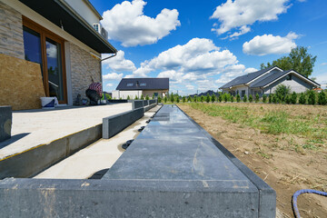 Ceramic terrace tiles on adjustable supports under construction. Elevated exterior floor build