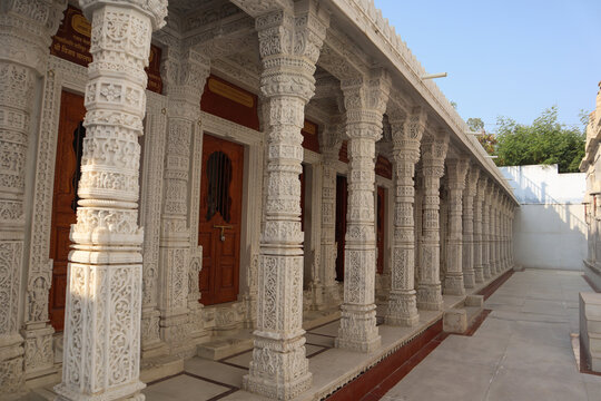  A Jain temple built in white marble with sculptures carved on the exteriors dedicated to Lord Mahavira  .at Udaipur in Rajasthan, India..
