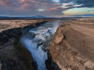 Panoramic summer view of popular tourist destination - Gullfoss waterfall in Iceland. Dramatic aerial view on Hvita river. Incredible morning scene of Iceland, Europe. 