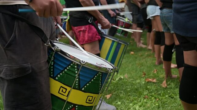 Group of people playing Afro-Brazilian percussion instruments