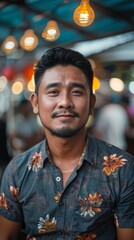 Fototapeta premium Filipino man with a casual shirt, looking cheerful
