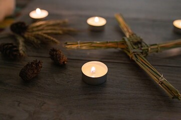Wiccan altar for Imbolc sabbath. religion winter-spring pagan festive ritual. Brigid's cross,...