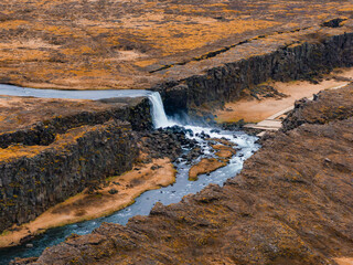 Aerial panorama of the Oxarafoss waterfalls in Iceland. Oxarafoss also called Oxararfoss is located in the Thingvellir National Park on the Oxara River. The tectonic plates of America and Eurasia.
