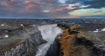 Aerial view of the Dettifoss Waterfall in Jokulsarglijufur National Park in Iceland. The Jokulsa-a-Fjollum River cascades 134m into the 500m wide canyon. Most powerful waterfall in Europe
