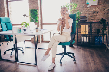 Full size photo of pretty young girl talk phone call wear trendy outfit modern workplace success business owner office
