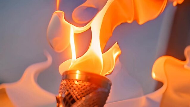 A gold Olympic torch with a fiery flame, captured in a close-up shot. Paris Olympics Games Concepts
