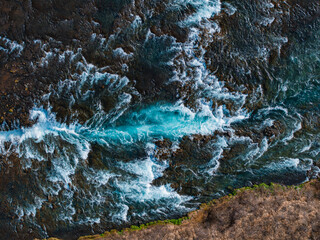 Majestic summer aerial view of Bruarfoss Waterfall. The Icelands Bluest Waterfall. Blue water flows...
