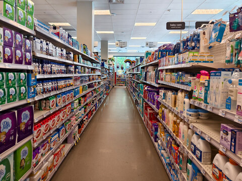 Miami Beach, Florida - June 24, 2024: Inside a CVS pharmacy store. Aisle in a grocery store filled with various products and supplies.
