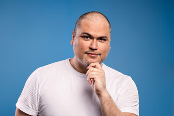 man with hand on chin