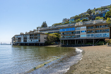 The waterfront dwellings of the coastal town of Sausalito near San Francisco, California as viewed from the beach.
