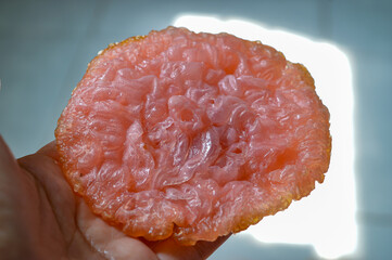 Kue Kucur or cucur is a traditional snack. Kue kucur with pink color.