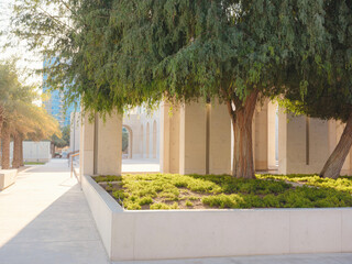 A city skyline in Abu Dhabi with a modern-looking park