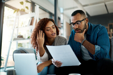 Financial paperwork, economy or couple with finance documents, laptop or household budget. Planning, thinking or people reading bills for accounting or debt with interest rates, invoice or inflation