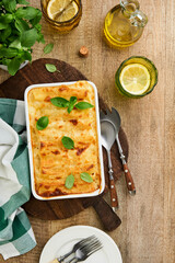 Italian cannelloni. Pasta casserole cannelloni with ground chicken, tomato and bechamel sauce. Traditional Italian pasta dish and recipe. Cover or article. Top view. Place for text.