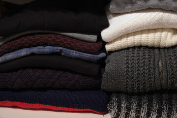 shelf full of winter sweaters