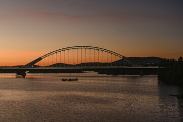 Naklejka premium Lusitania Bridge Silhouetted Against Sunset, Merida, Spain