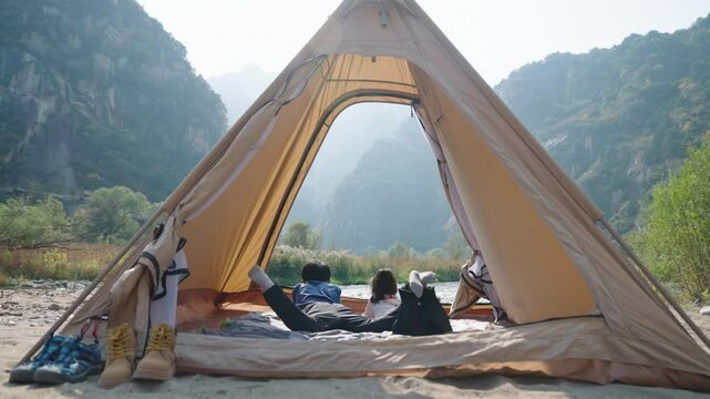 Cute Children looking out from tent